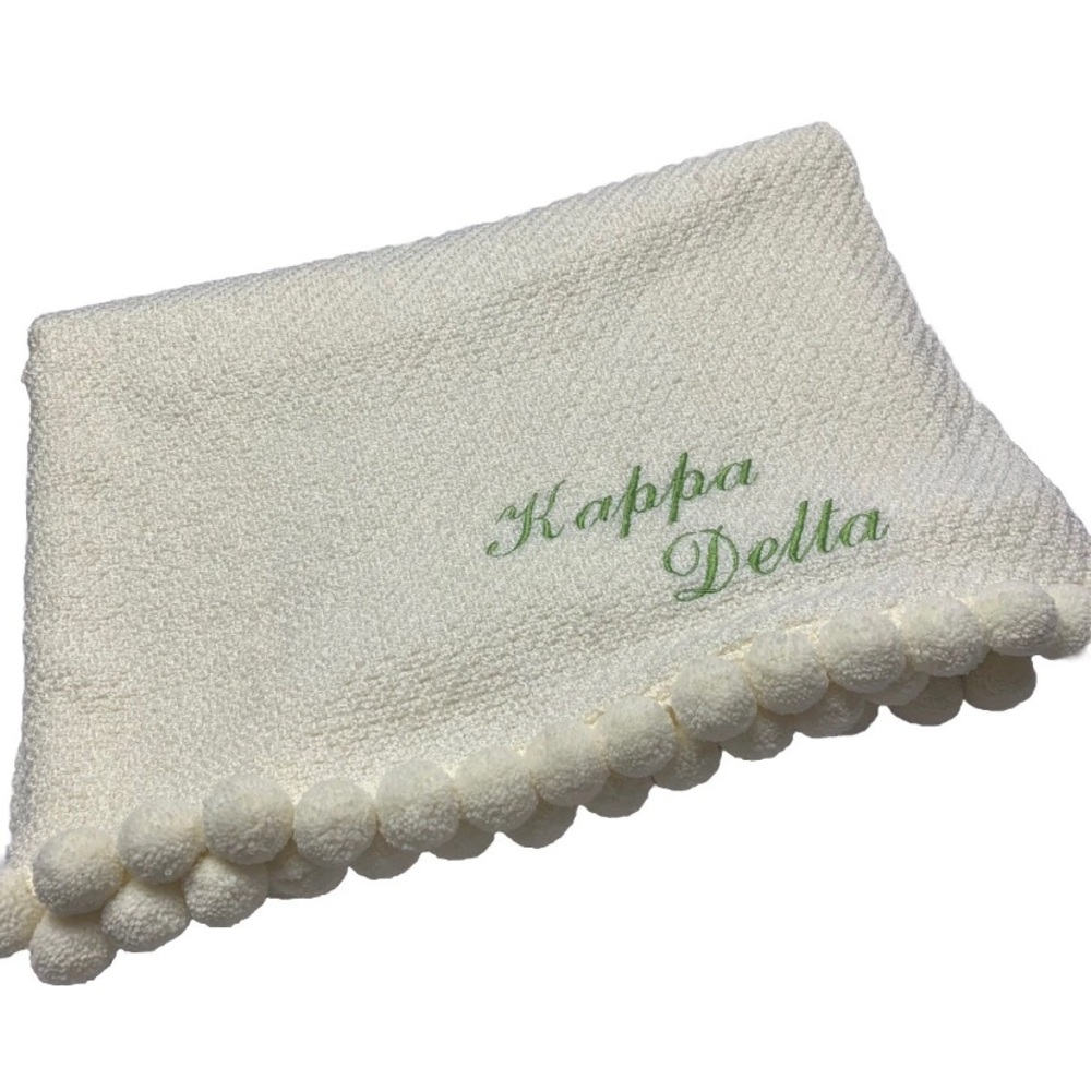 KAPPA DELTA embroidered on Ivory Martha Stewart throw w/Large Pom Pom trim